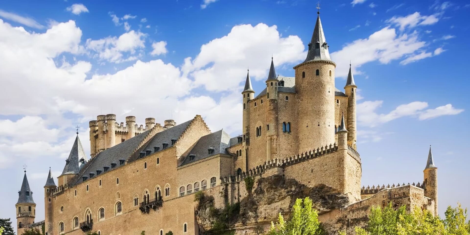 Majestic Alcazar castle on sunny day with blue sky.