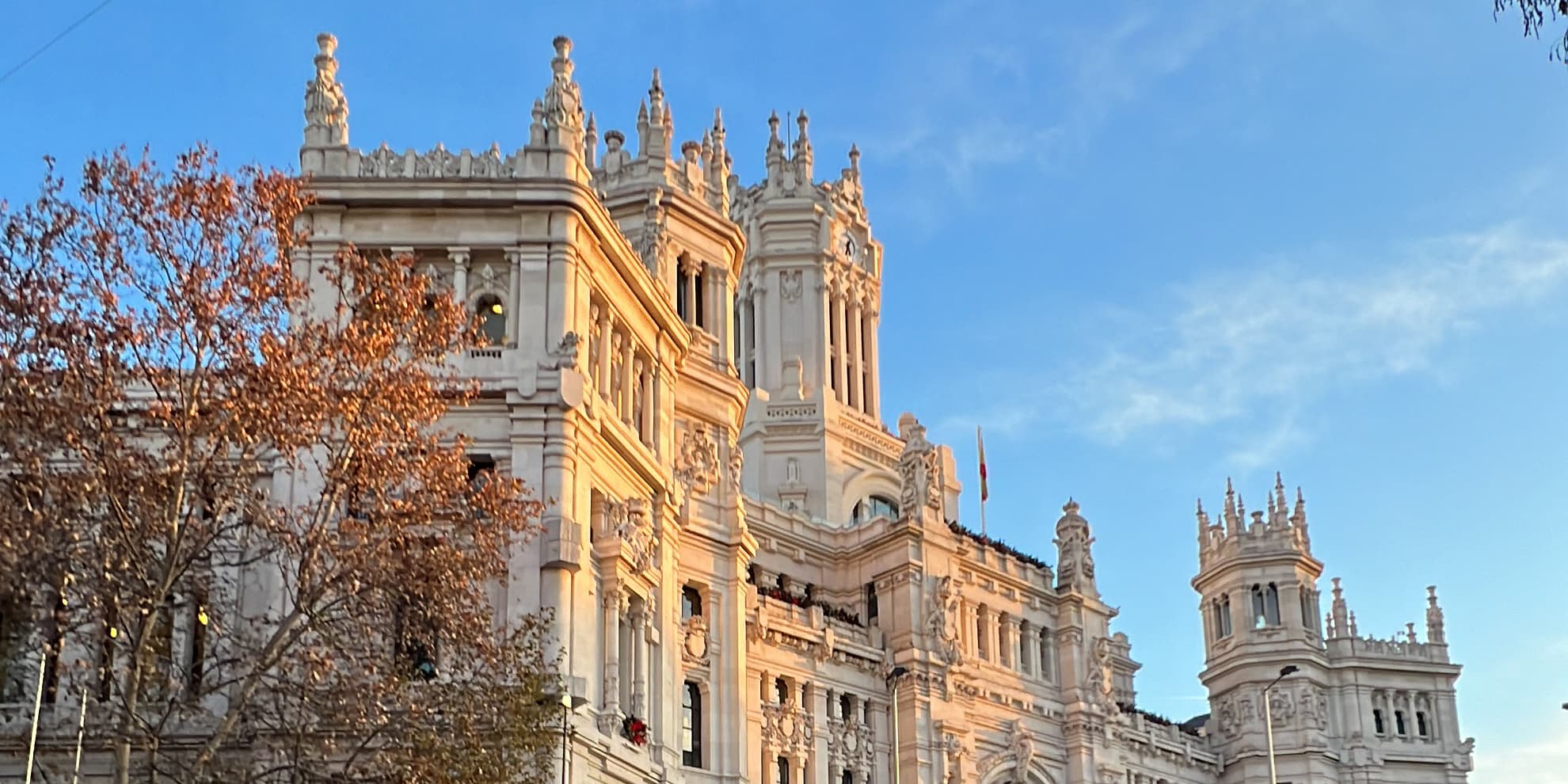 Cybele Palace or Palacio de Cibeles in Madrid in soft golden light