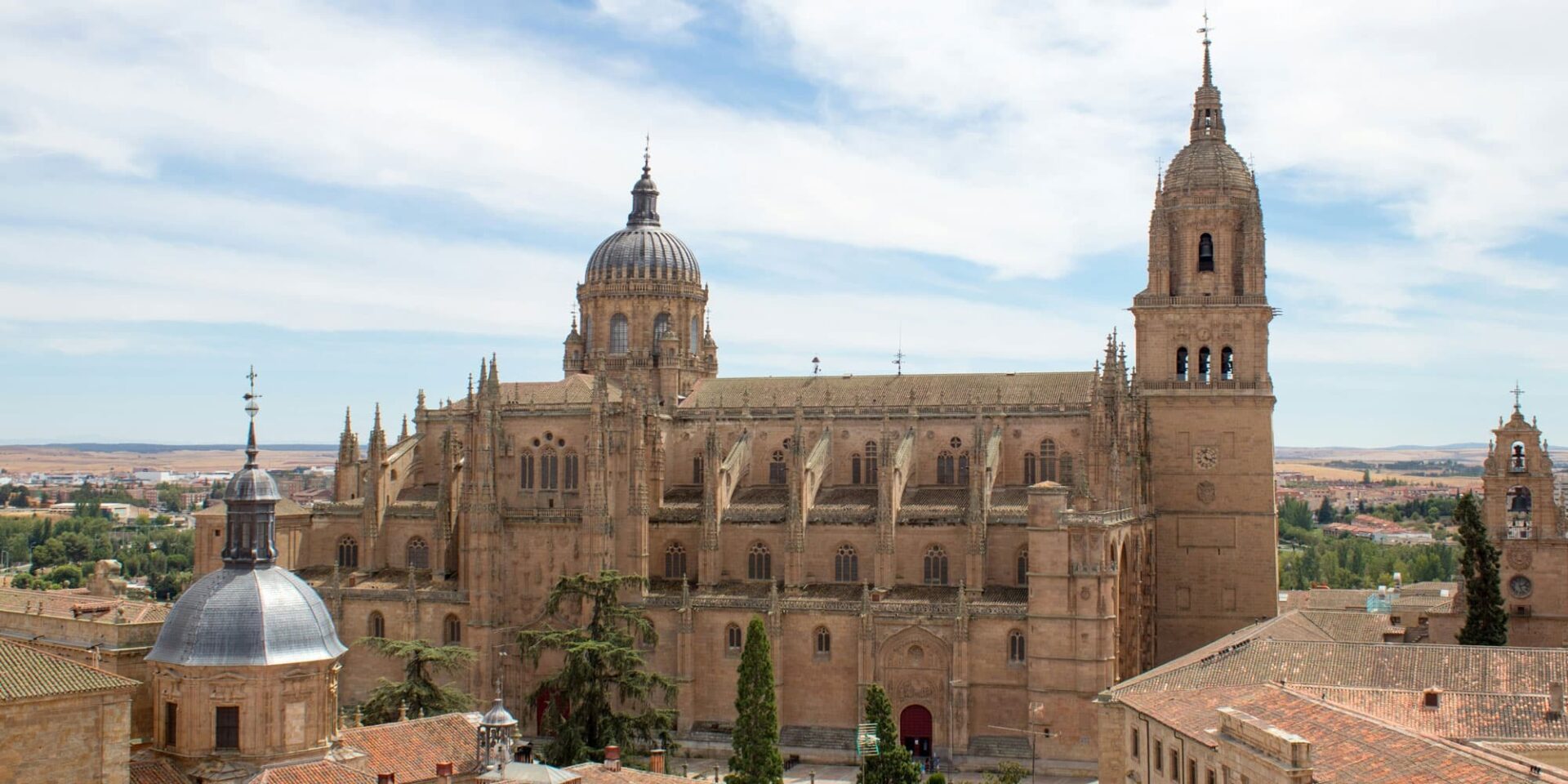 Historic cathedral overlooking scenic landscape in Salamanca, Spain.